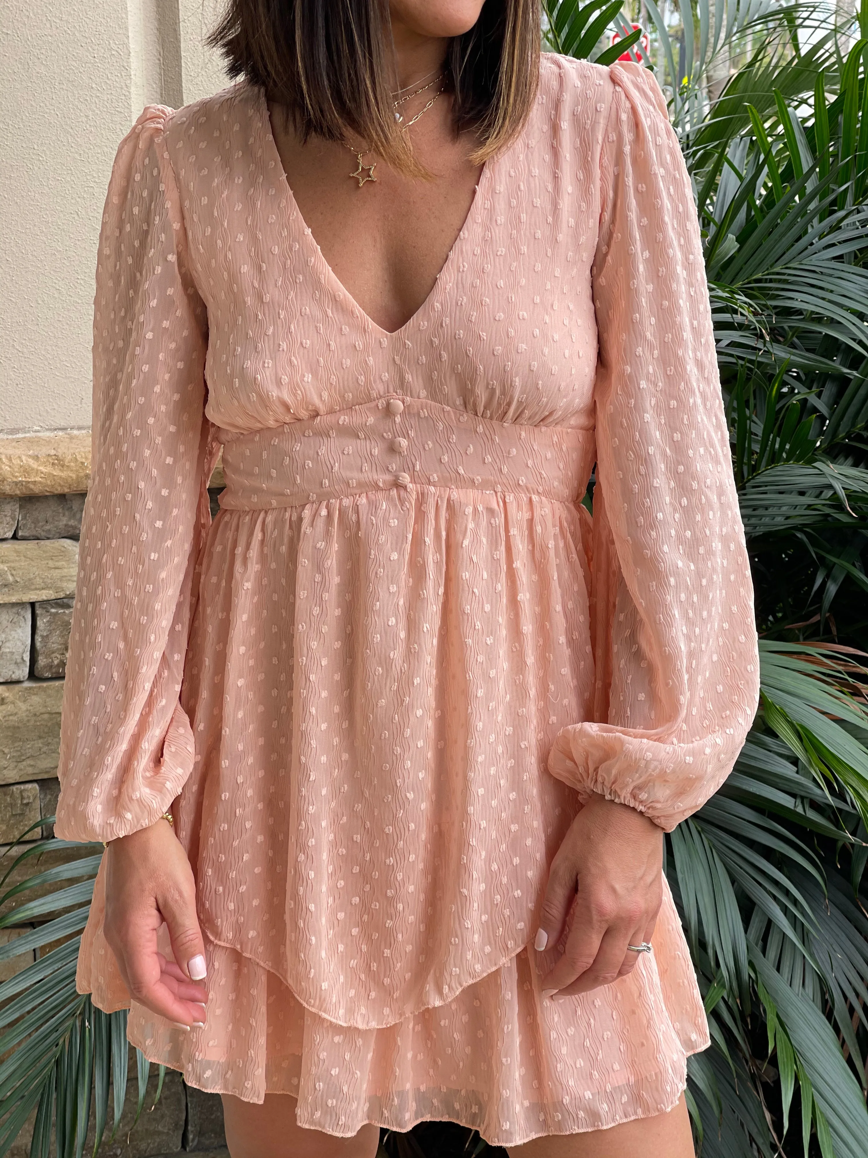 Textured feminine short dress with baggy long sleeves.